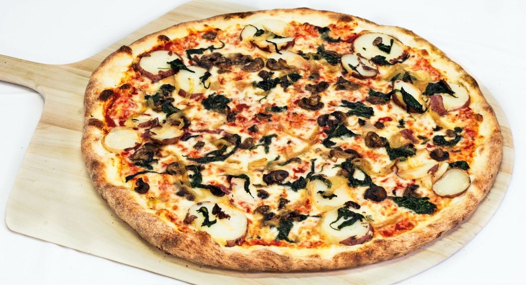 Pizza with cheese, onion, mushroom, spinach, and red potato 