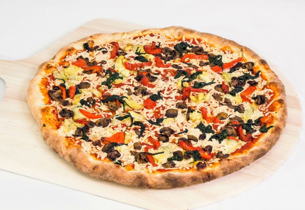 Vegan mozzarella, spinach, mushrooms, artichoke, and bell peppers pizza