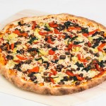 vegan mozzarella, spinach, mushrooms, artichoke, and bell peppers pizza